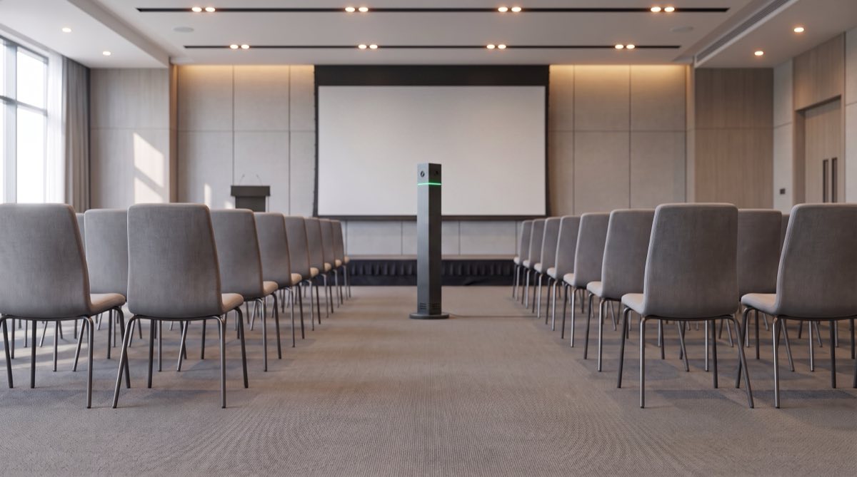 An IRIS tower standing at the front of a room, facing the audience seating